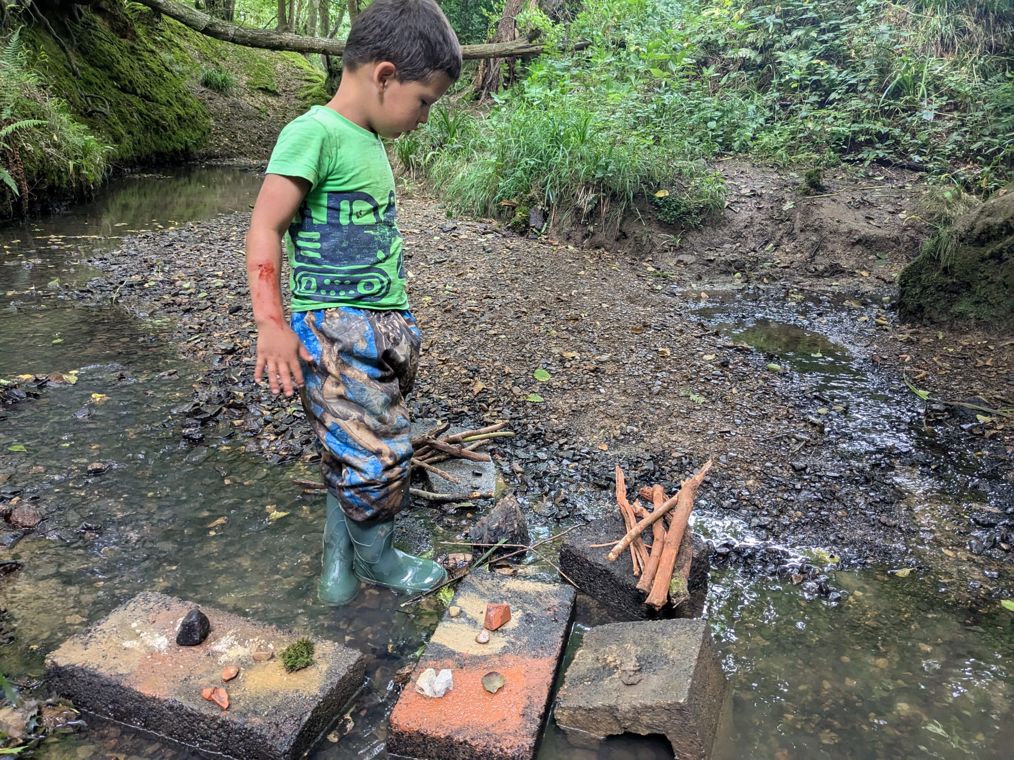 boy doing rock painting