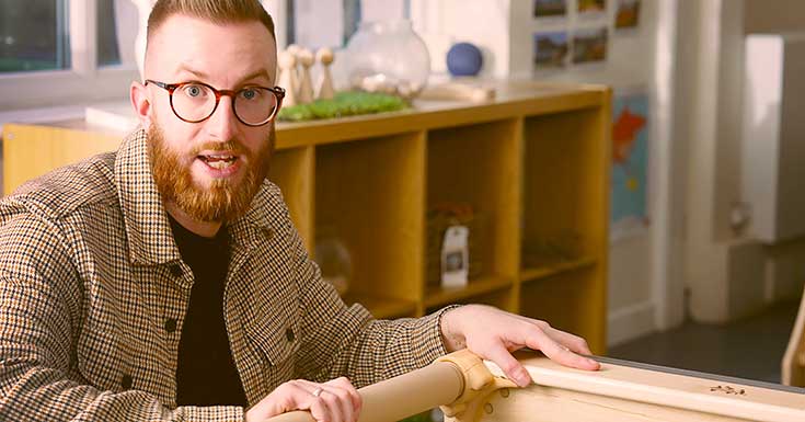 A teacher demonstrates the functions of the Activity tray-table