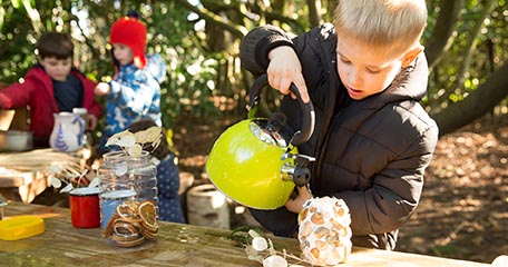 Children playing at the mud kitchen